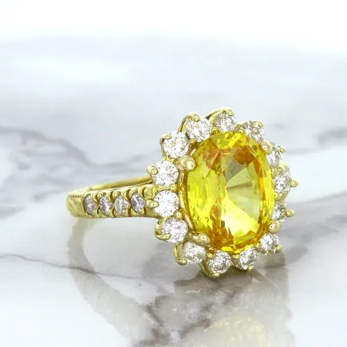 4.04ct Oval Yellow Sapphire Ring with Diamond Halo in 14K Yellow Gold