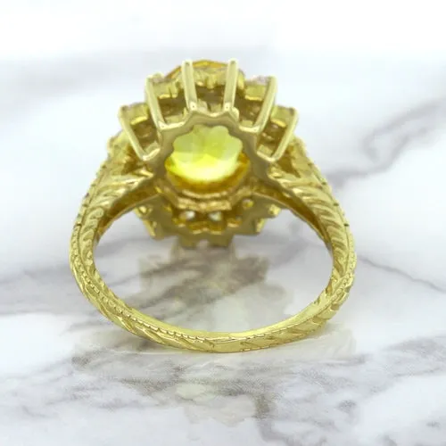4.04ct Oval Yellow Sapphire Ring with Diamond Halo in 14K Yellow Gold
