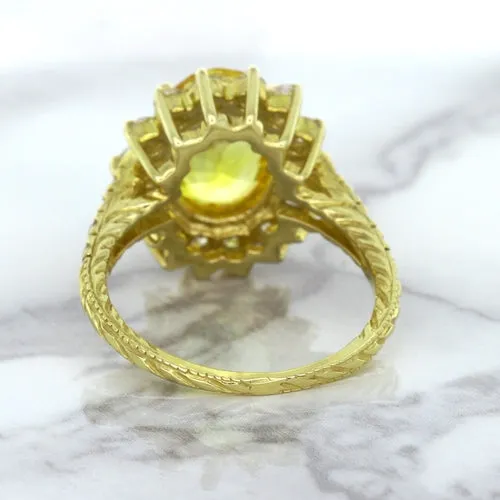 4.04ct Oval Yellow Sapphire Ring with Diamond Halo in 14K Yellow Gold