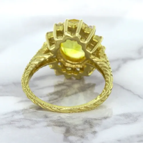 4.04ct Oval Yellow Sapphire Ring with Diamond Halo in 14K Yellow Gold