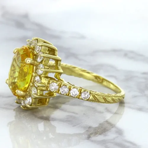 4.04ct Oval Yellow Sapphire Ring with Diamond Halo in 14K Yellow Gold