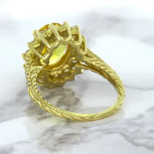 4.04ct Oval Yellow Sapphire Ring with Diamond Halo in 14K Yellow Gold