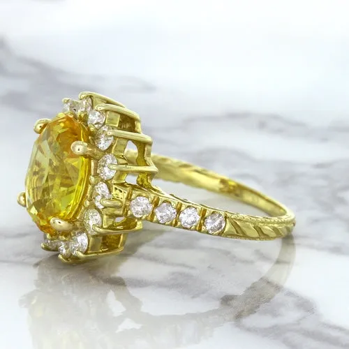 4.04ct Oval Yellow Sapphire Ring with Diamond Halo in 14K Yellow Gold