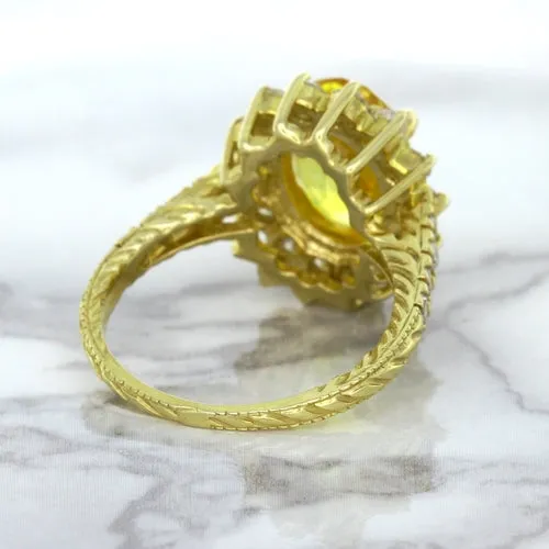 4.04ct Oval Yellow Sapphire Ring with Diamond Halo in 14K Yellow Gold