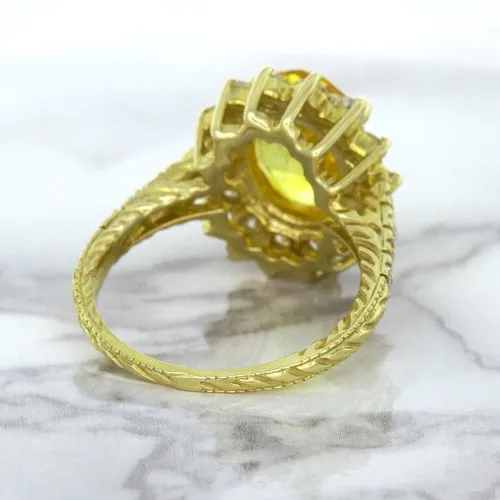 4.04ct Oval Yellow Sapphire Ring with Diamond Halo in 14K Yellow Gold