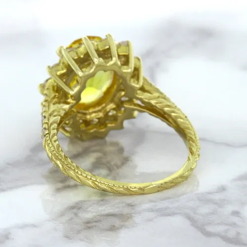 4.04ct Oval Yellow Sapphire Ring with Diamond Halo in 14K Yellow Gold