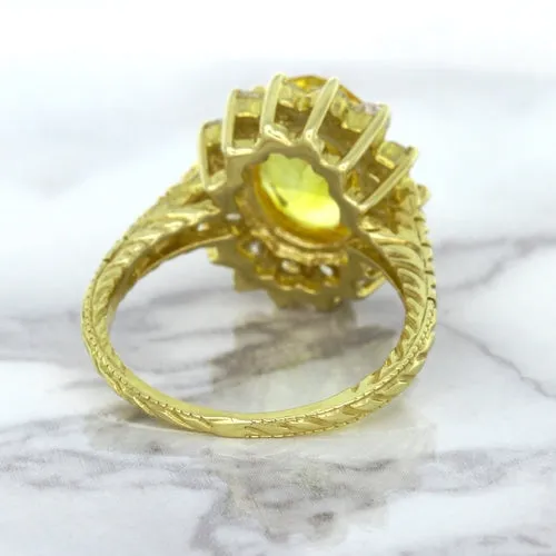 4.04ct Oval Yellow Sapphire Ring with Diamond Halo in 14K Yellow Gold