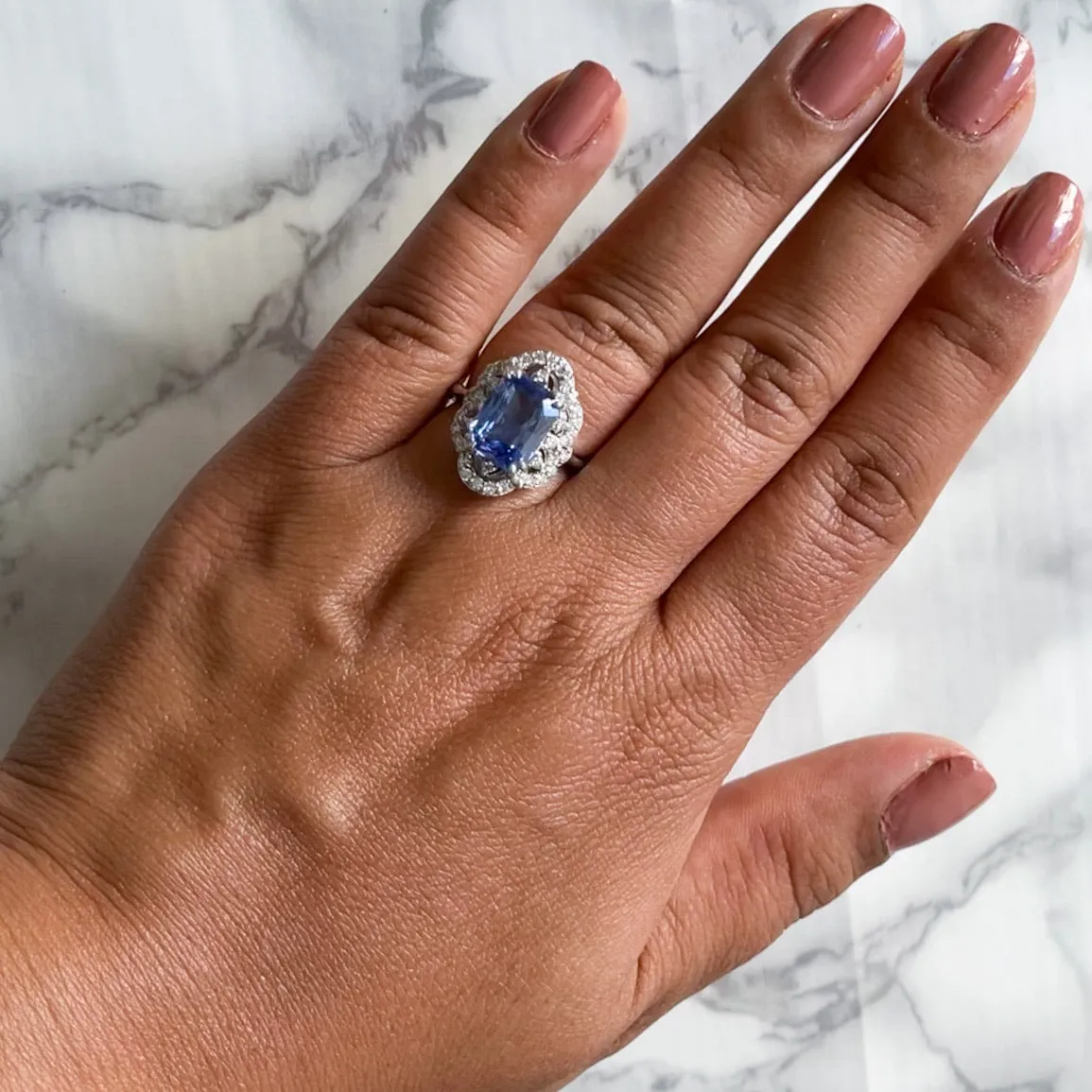 4.37ct Radiant Blue Sapphire Ring with Diamond Halo in Platinum