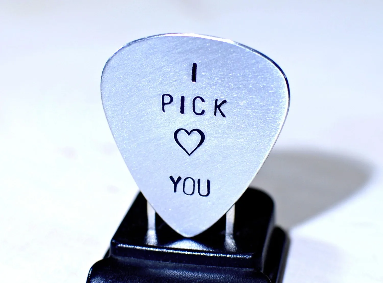 Aluminum I pick you guitar pick with a small heart design