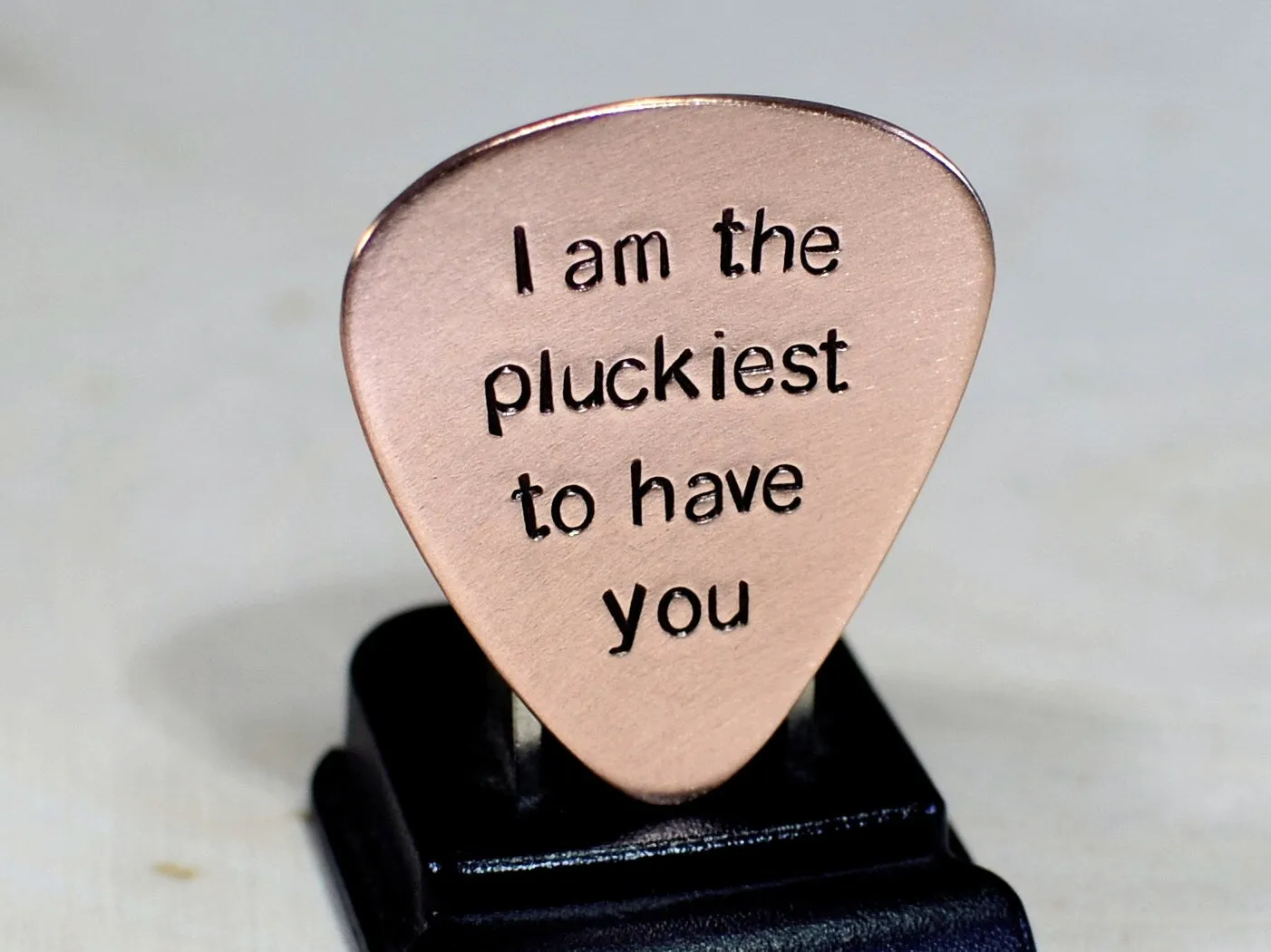 Copper guitar pick with I am the pluckiest to have you