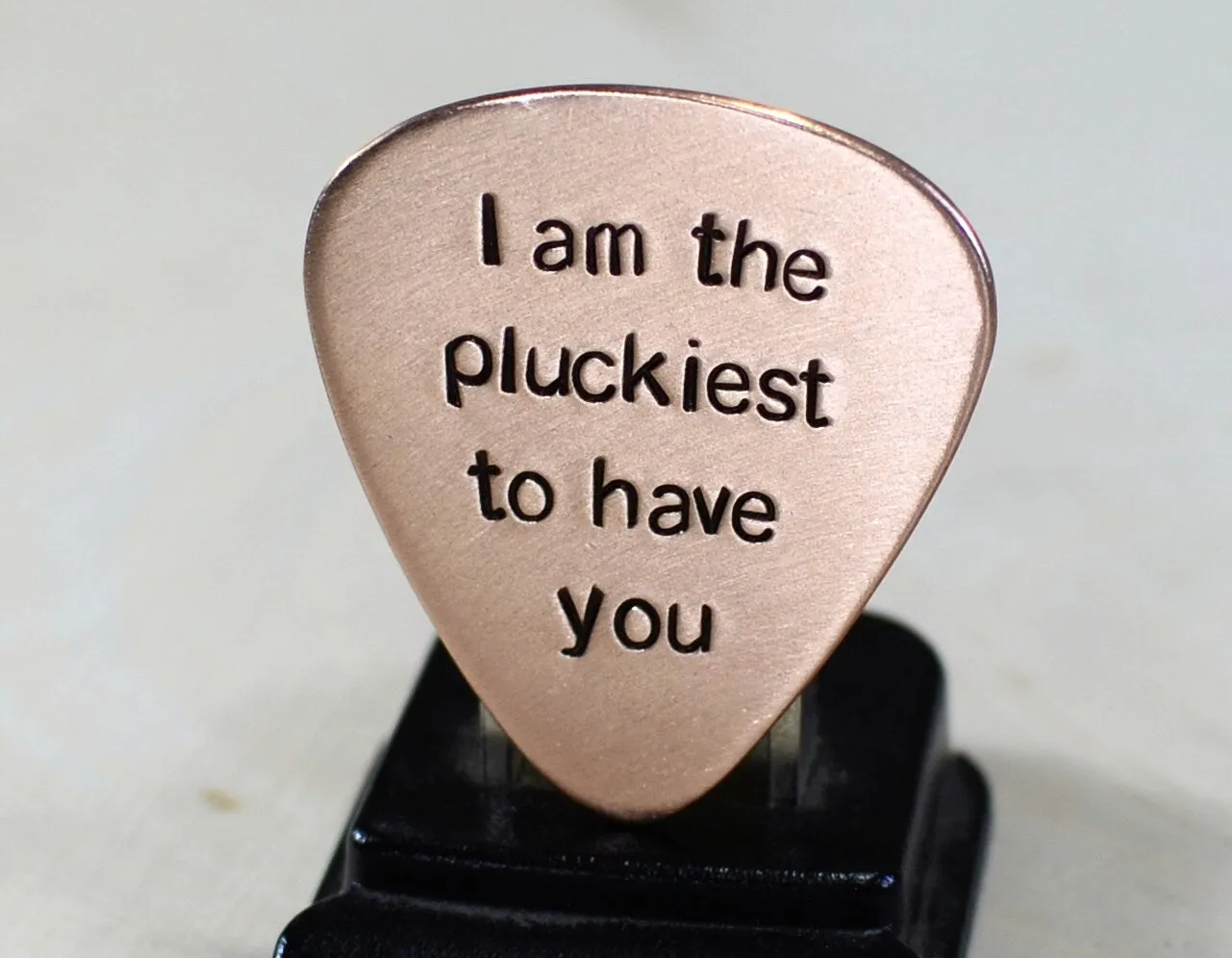 Copper guitar pick with I am the pluckiest to have you