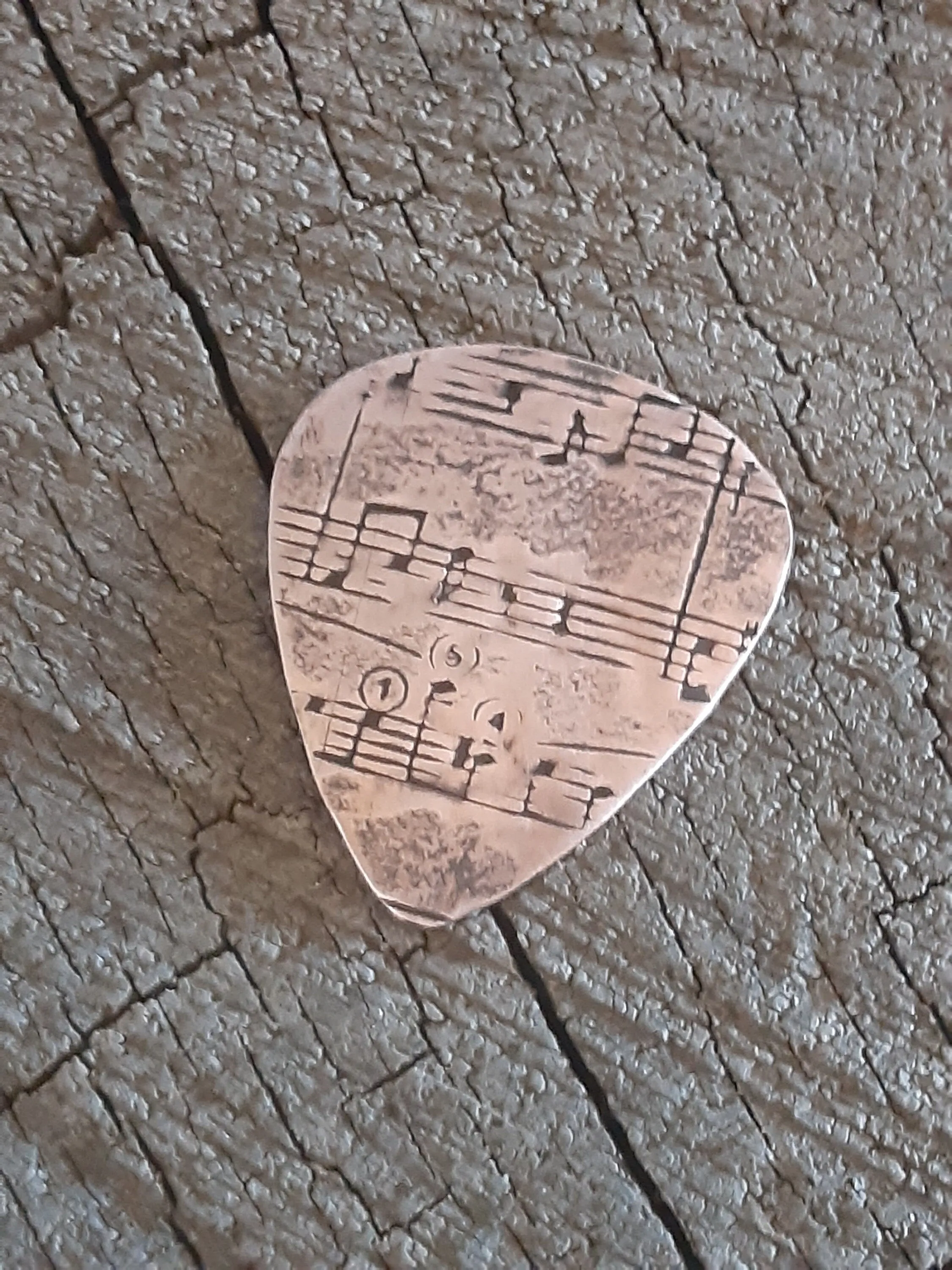 Copper guitar pick with music notes - for Elise