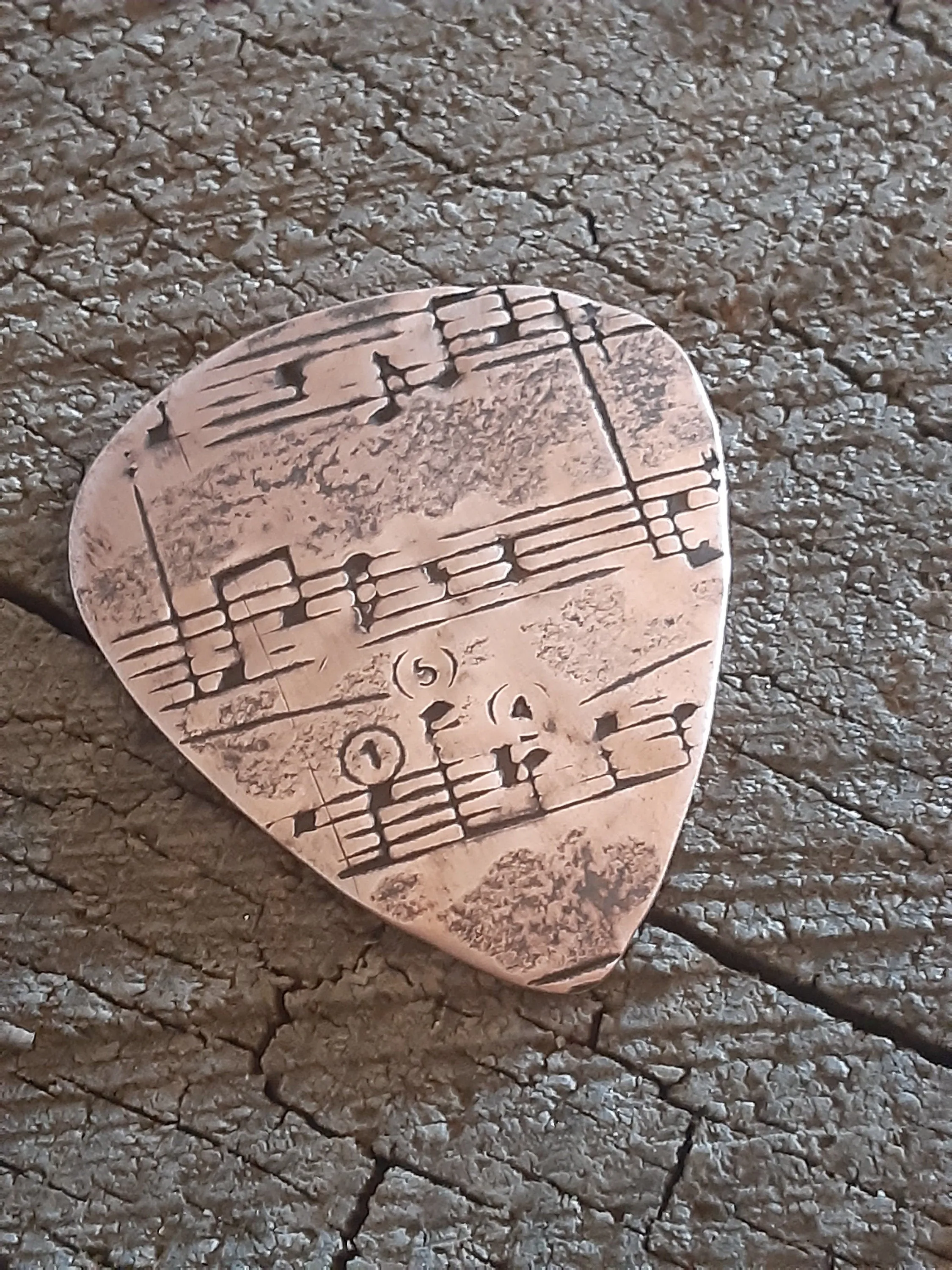 Copper guitar pick with music notes - for Elise