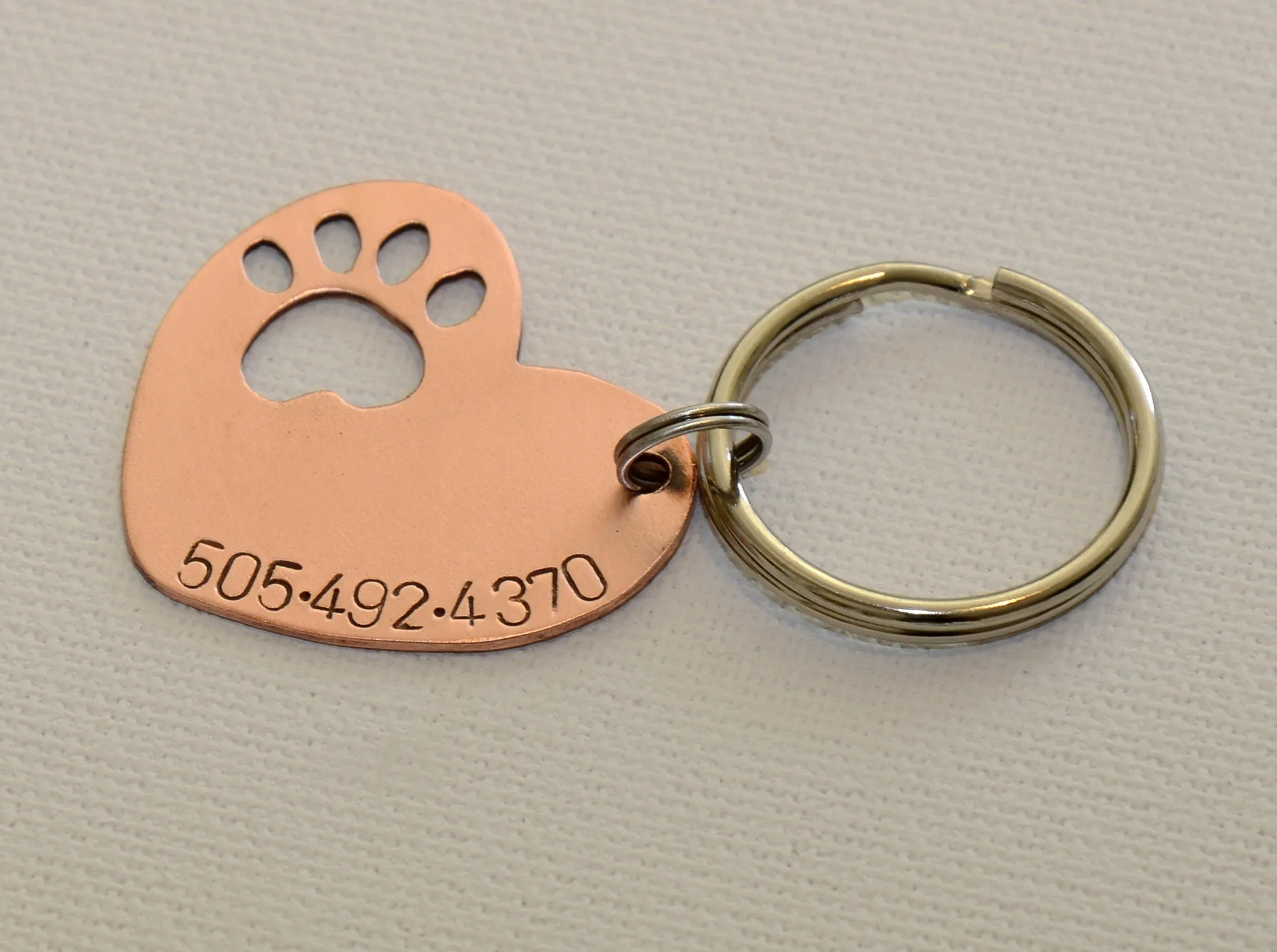 Copper heart shaped dog tag
