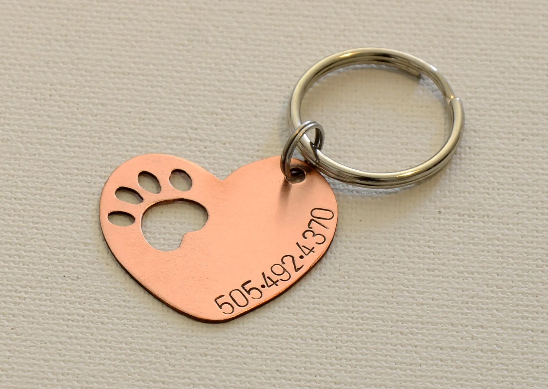 Copper heart shaped dog tag