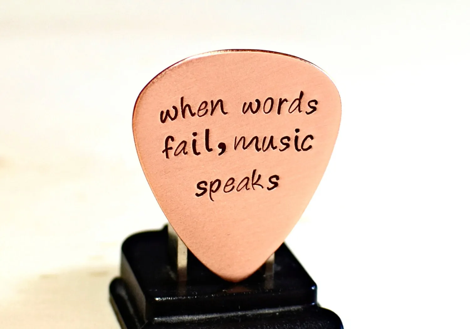 Guitar Pick with When Words Fail Music Speaks in Copper