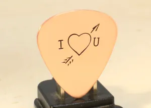 I love you copper guitar pick with Cupid's arrow of love straight through the heart