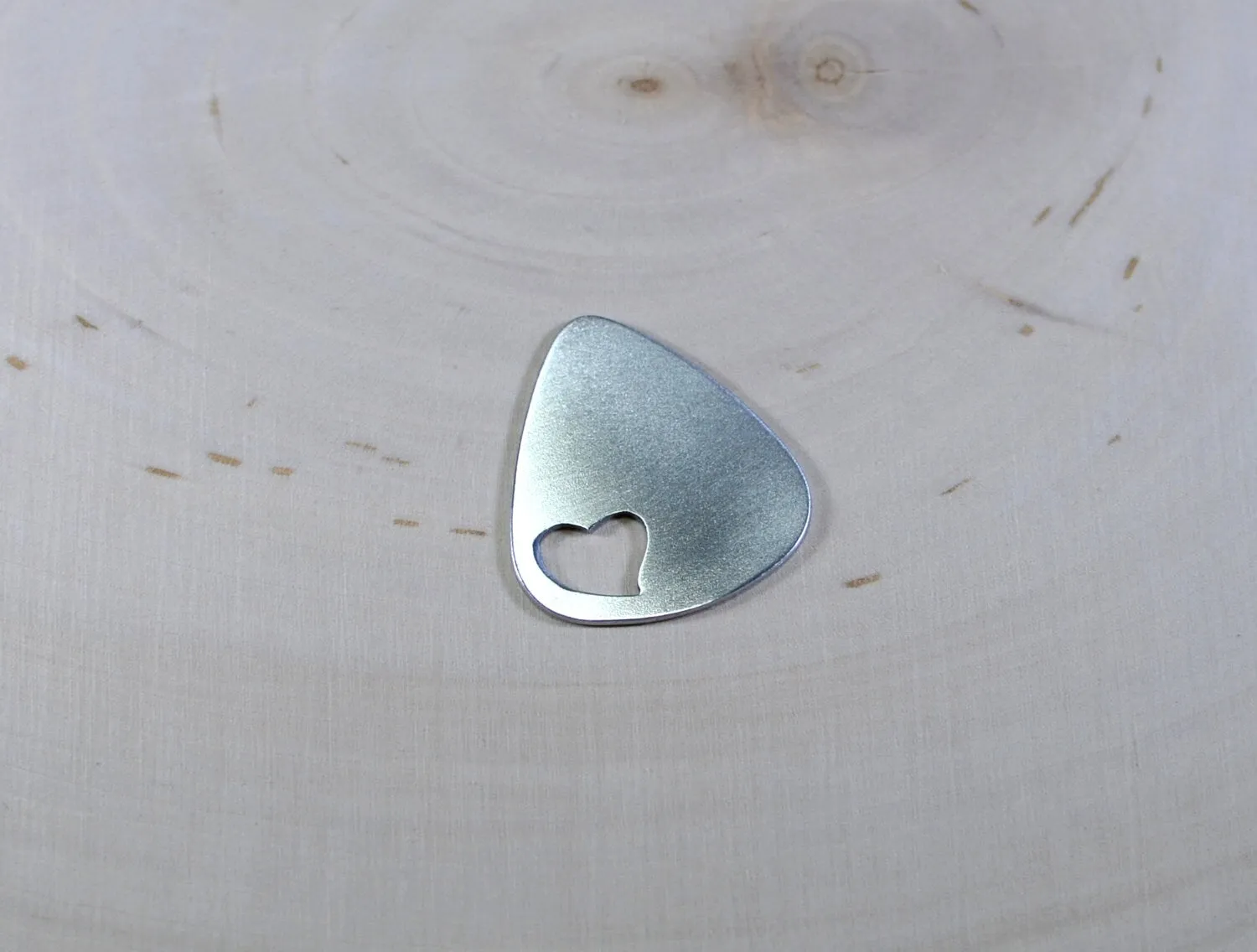 Love Guitar Pick with Cutout Heart in various metals