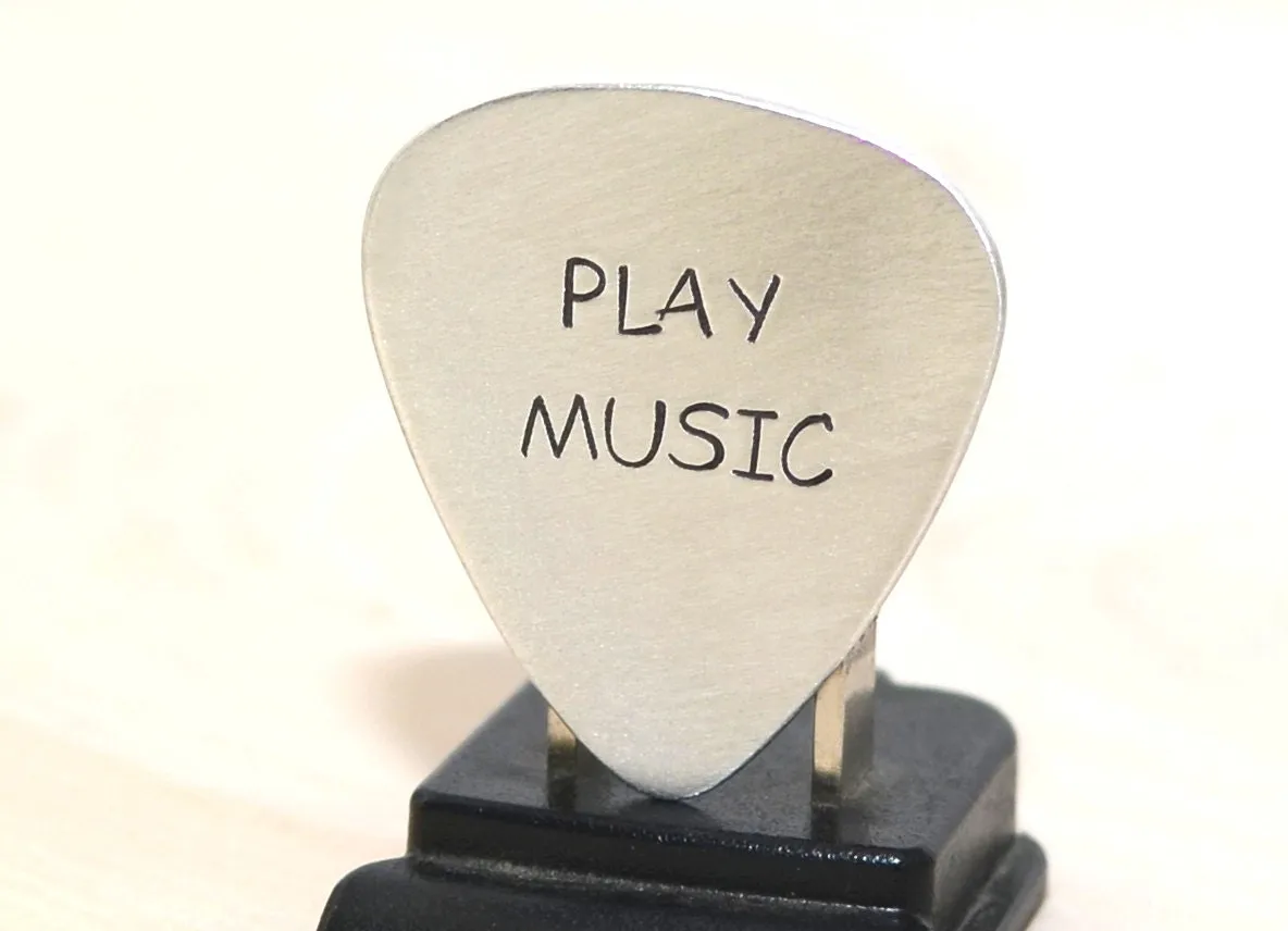 Play music guitar pick in your choice of metals