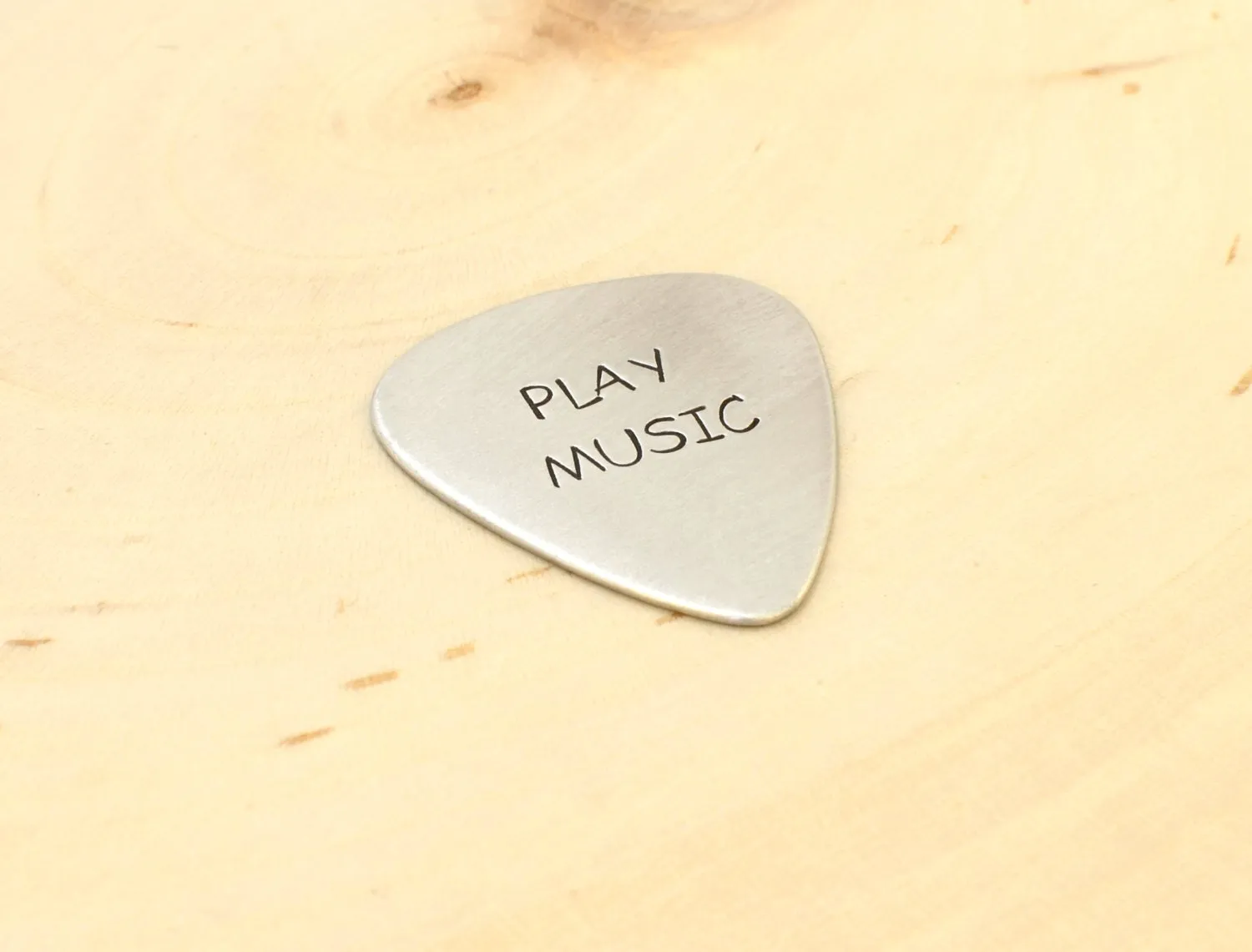 Play music guitar pick in your choice of metals
