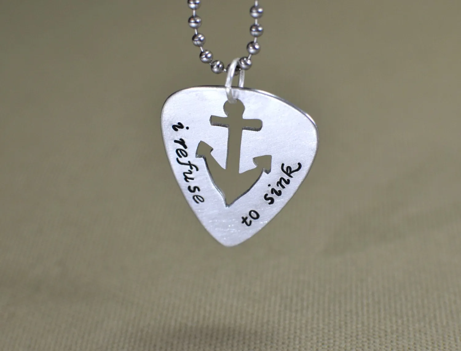 Refuse to sink guitar pick necklace with anchor design