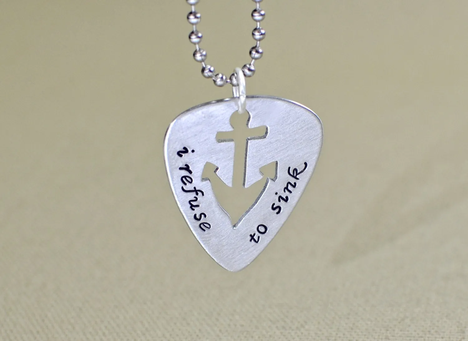 Refuse to sink guitar pick necklace with anchor design