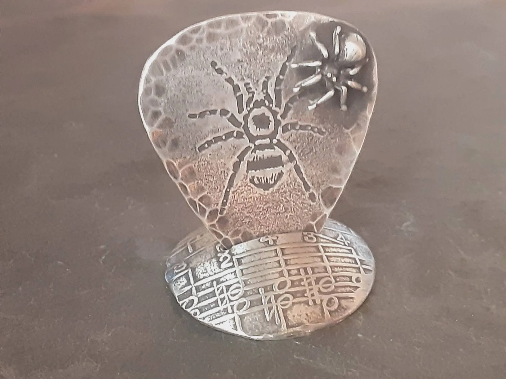 Spider themed sterling silver guitar pick with 3D spider and guitar pick holder stand