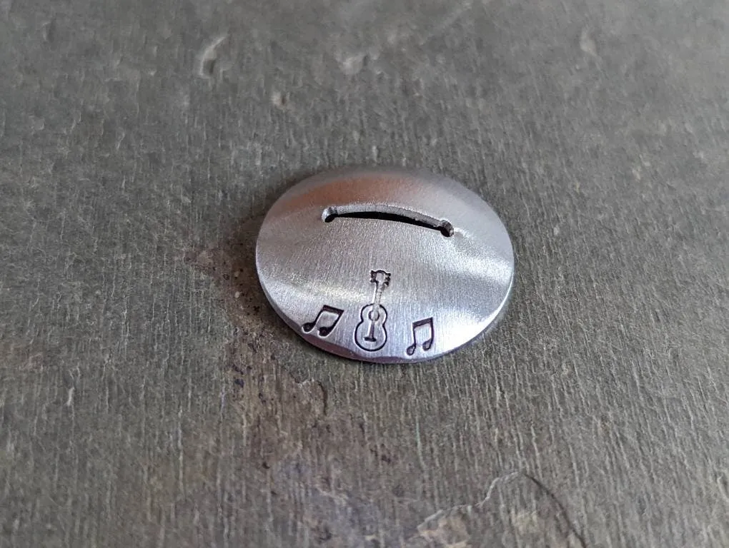 Sterling silver guitar pick stand with music notes and guitar theme