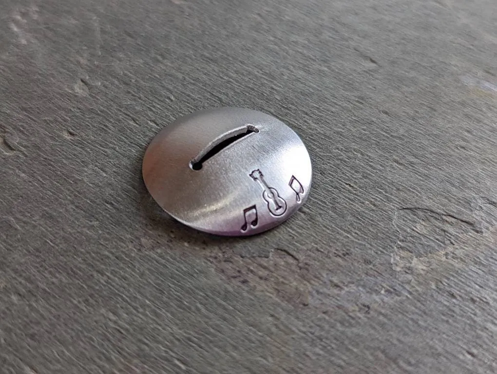 Sterling silver guitar pick stand with music notes and guitar theme