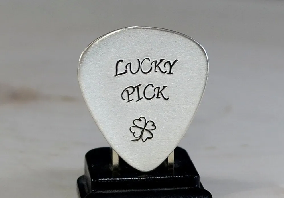 Sterling silver lucky guitar pick with four leaf clover