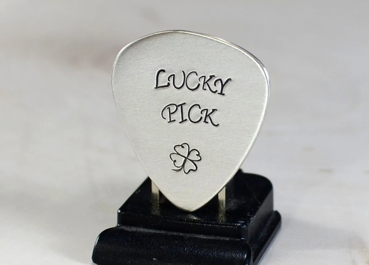 Sterling silver lucky guitar pick with four leaf clover