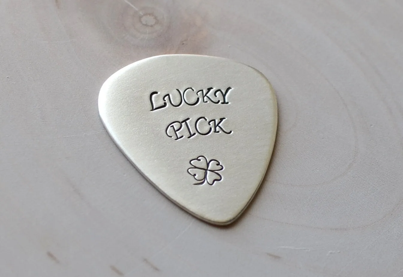 Sterling silver lucky guitar pick with four leaf clover