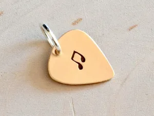 Tiny bronze guitar pick charm