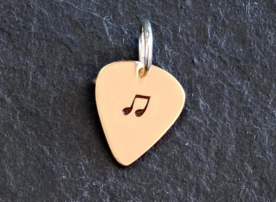 Tiny bronze guitar pick charm