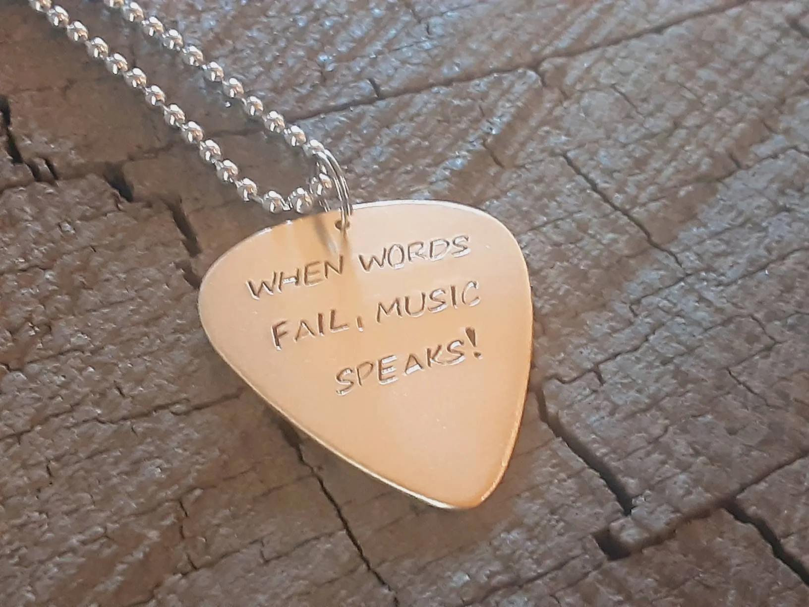 When words fail music speaks bronze necklace with guitar pick