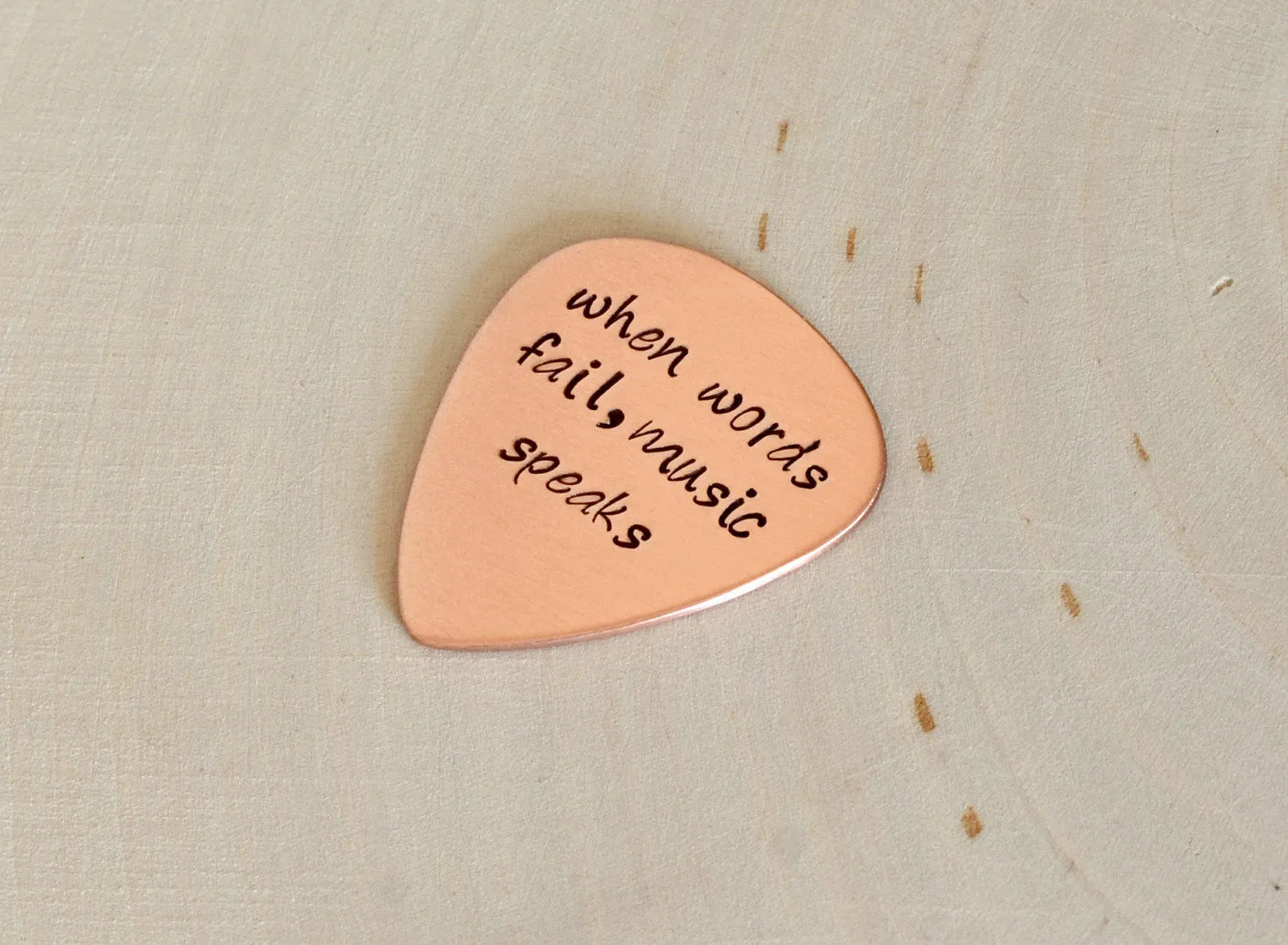 When Words Fail Music Speaks copper guitar pick