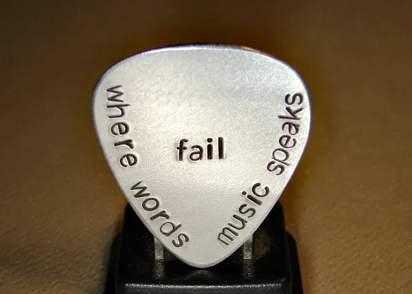 Where words fail music speaks aluminum guitar pick
