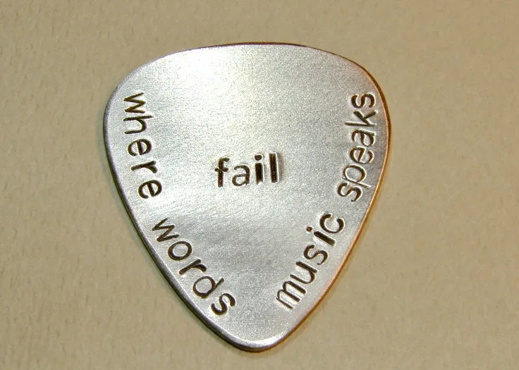 Where words fail music speaks aluminum guitar pick