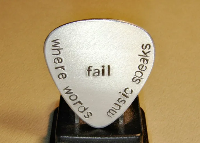 Where words fail music speaks aluminum guitar pick